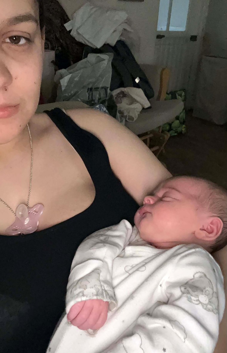 Sofii Lewis pictured with baby Evie. "I have no life in my eyes," Lewis said of the photograph.Courtesy of Sofii Lewis