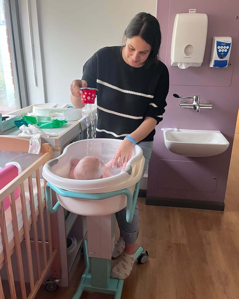 Lewis bathing Evie during their monthslong care at a Mother and Baby Unit in the U.K. in 2023.Courtesy of Sofii Lewis