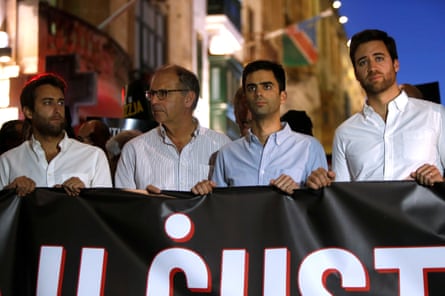 Caruana Galizia’s sons Matthew, Paul and Andrew and her husband, Peter, take part in a protest march in Valletta in 2019.Photograph: Darrin Zammit Lupi/Reuters