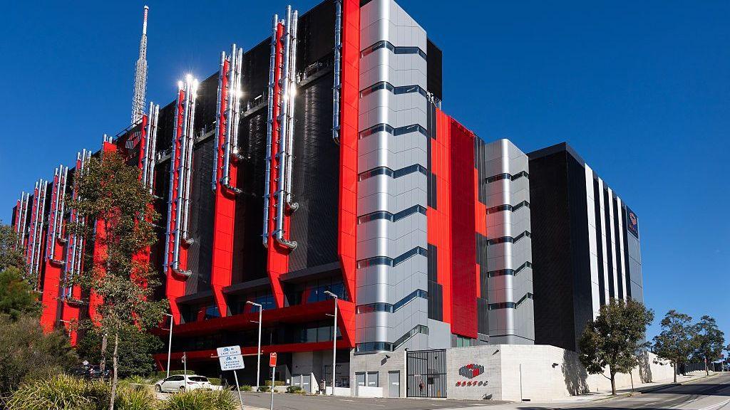 Image caption,A data centre in Artarmon, Sydney. The huge windowless buildings use massive amounts of energy and water