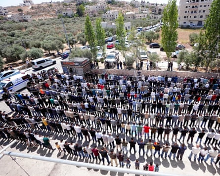 Mourners at the funeral ceremony of Khalil Abu Alia, 16, and Omar al-Nassan, 19.Photograph: Zain Jaafar/AFP/Getty Images