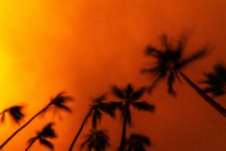 Wildfires burn over the town of Lahaina as seen in the neighboring Kaanapali Alii resort in May 2023.Photograph: Gonzalo Marroquin/Getty Images