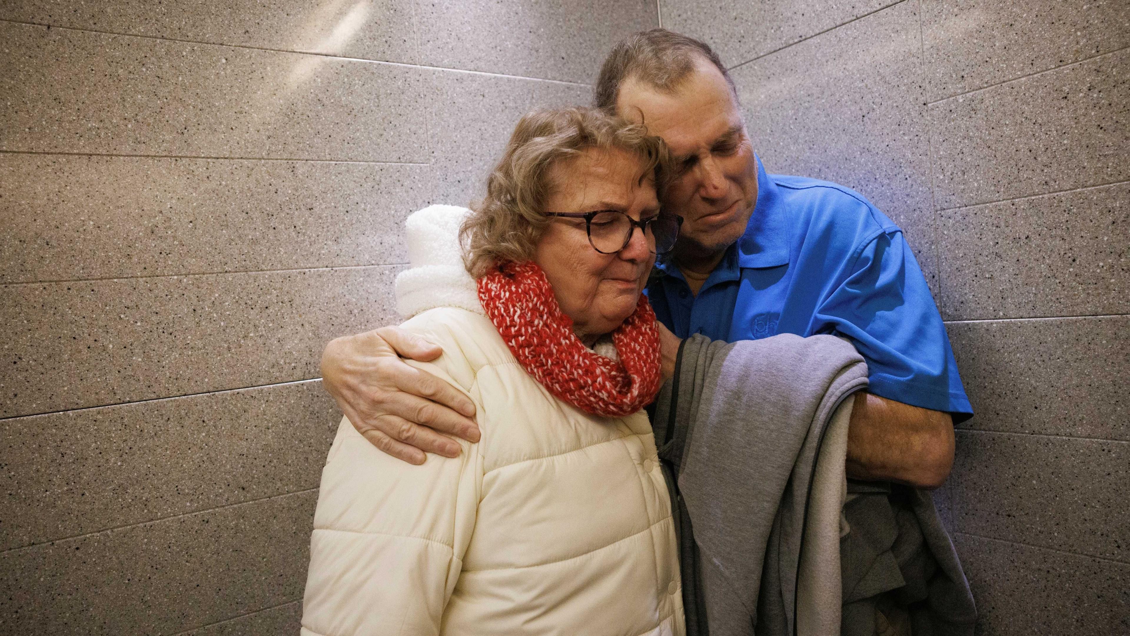 Image caption,An emotional Tim Andrews and his wife Karen share an embrace while leaving Massachusetts General Hospital on Feb 1, 2025