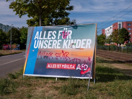 An AfD billboard reads ‘All for our children’. The party has promised to educate refugee children in the state separately. Photograph: Christian Jungeblodt/The Guardian