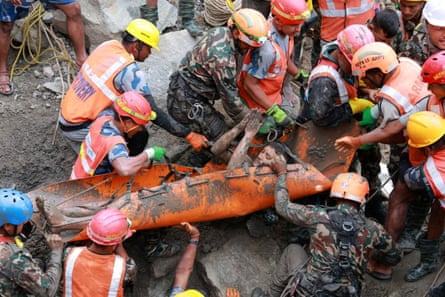 A survivor is carried out after being rescued from inside the tunnel.Photograph: Nepal Army/Reuters
