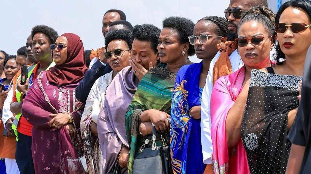Image caption,Royal mourners watched on during the short ceremony at the airport