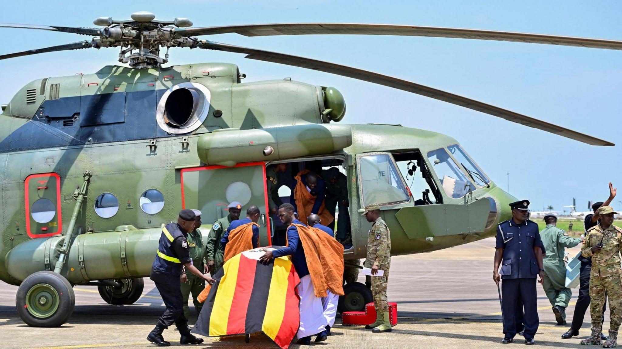 Image caption,The casket with the body of the king was then flown by military helicopter to western Uganda