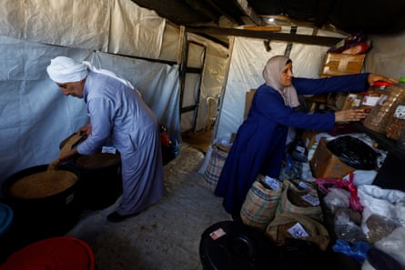 Salama Muhanna with his daughter Hanadi inside the seed bank.Photograph: Mahmoud Issa/Reuters