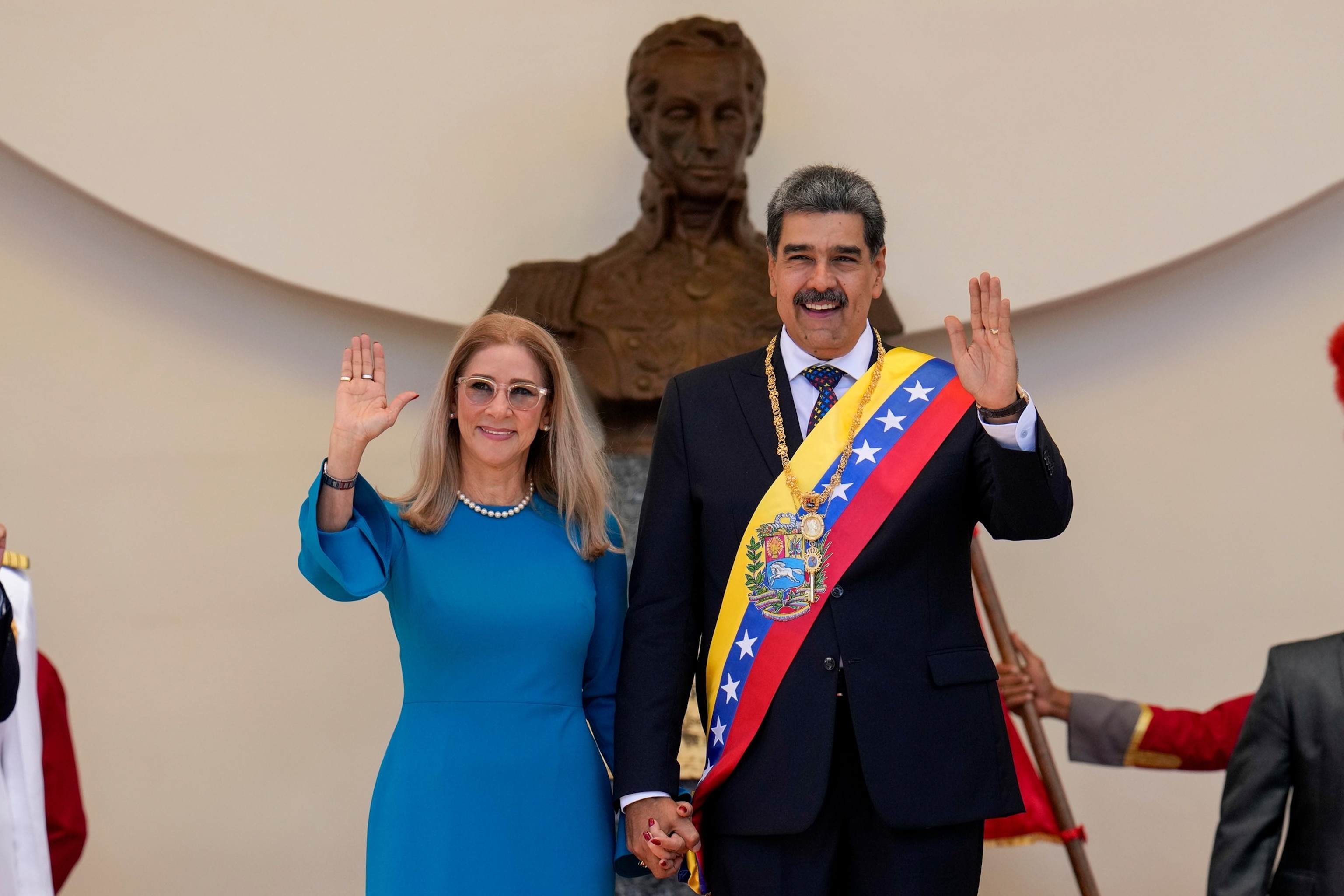 Venezuelan President Nicolas Maduro and his wife Cilia Flores wave after his swearing-in ceremony for a third term at the National Assembly in Caracas, Venezuela, Jan. 10, 2025.Ariana Cubillos/AP Photo