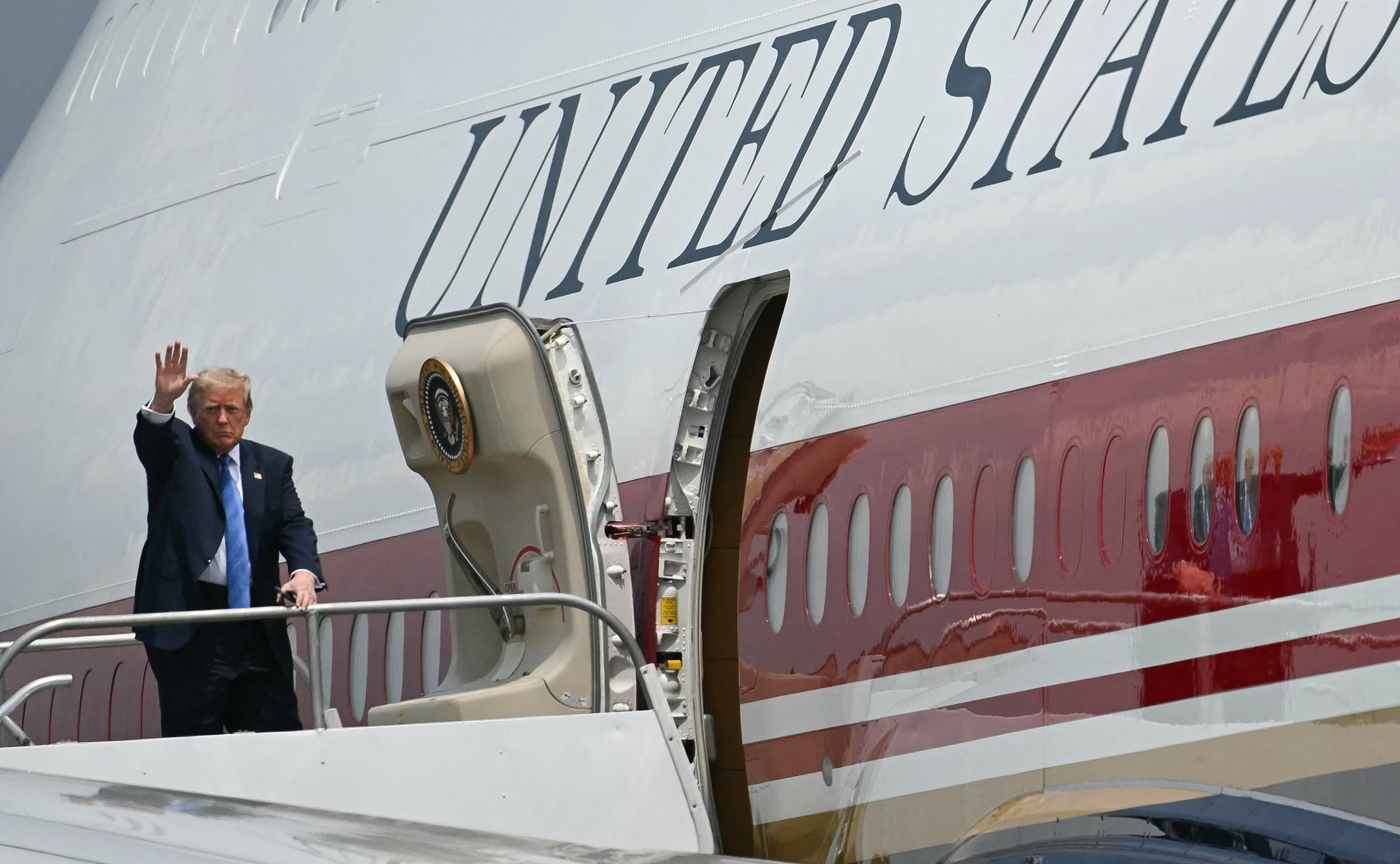 President Donald Trump waves as he boards Air Force One at Ellington Airport in Houston, Texas, August 28, 2026.Kent Nishimura/AFP via Getty Images