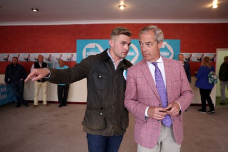 Dan Jukes, left, speaks to Nigel Farage before an interview in Clacton-on-Sea in July 2024.Photograph: Hollie Adams/Reuters