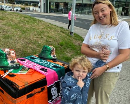 Catherine Hill and her son at a stall with Katie Taylor merchandise near the boxer’s family home in Bray.Photograph: Rory Carroll/The Guardian