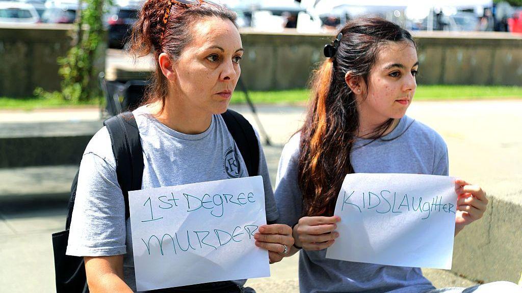 Image caption,Those who believed Clancy should be held accountable for the killings also had a presence outside the court