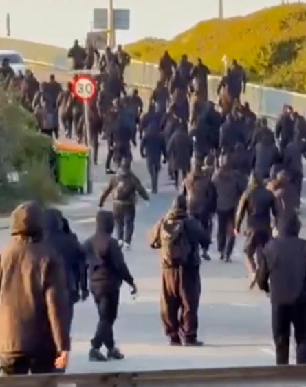 Masked people on the road in Dover.Photograph: Ay_audits/YouTube