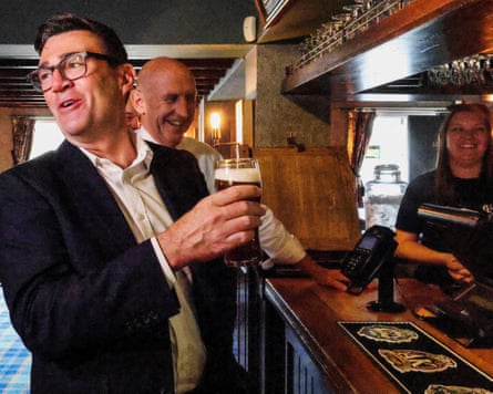 Andy Burnham and John Healey visit the Hare Inn in Harlow, Essex, in July.Photograph: Richard Pohle/Reuters