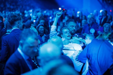 A heckler is carried out during Nigel Farage’s keynote speech on the second day of Reform UK Annual Conference at NEC in Birmingham, Britain, 4 September 2026.Photograph: Tolga Akmen/EPA