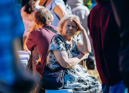 People gathered outside after a Russian attack in the Solomianskyi district of Kyiv last month.Photograph: Julia Kochetova/The Guardian