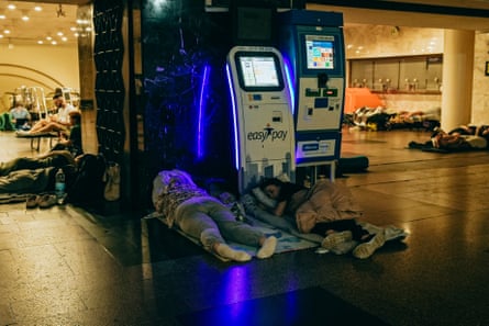 People sleeping at Dorohozhychi subway station because of the threat of Russian night attacks.Photograph: Julia Kochetova/The Guardian
