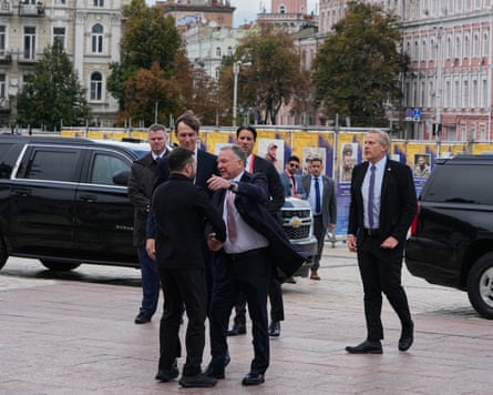 Volodymyr Zelenskyy greets Steve Witkoff and Jared Kushner in Kyiv’s Sophia Square.Photograph: Efrem Lukatsky/AP