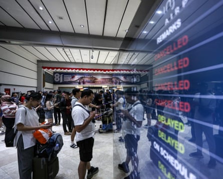 Passengers wait in the check-in lounge at Soekarno-Hatta international airport.Photograph: Faisal Ramadhan/EPA
