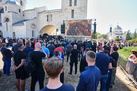 Mourners including Serbian veteran soldiers queue as they arrive to take part in a public memorial.Photograph: Oliver Bunic/AFP/Getty Images