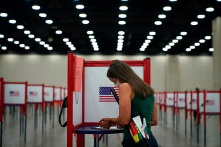 A Kentucky voter in Louisville casts her ballot.Photograph: Bryan Woolston/Reuters