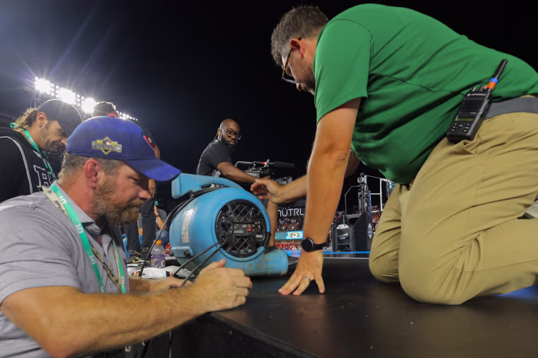 Even high-powered fans weren't enough to dry the court sufficiently.Melissa Tamez / AP