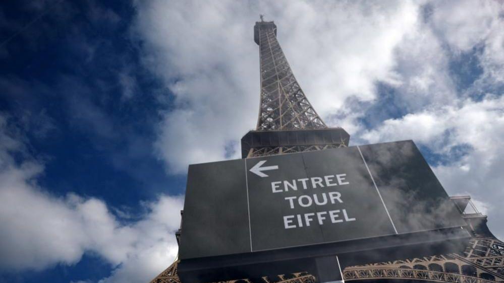 Image caption,The Eiffel Tower on Monday was closed after a staff strike over the visit