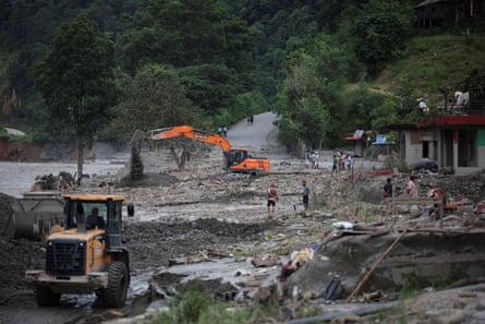 An excavator repairs a damaged road in Nepal near the Trishuli River on Monday.Photograph: Anushree Fadnavis/Reuters