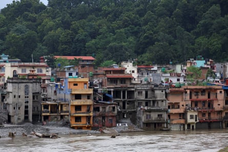 Damaged buildings on the banks of the Trishuli River.Photograph: Anushree Fadnavis/Reuters