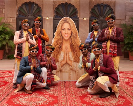 First of many mashups … Ismail Langa Group pose with a larger-than-life image of Shakira.Photograph: Ismail Langa