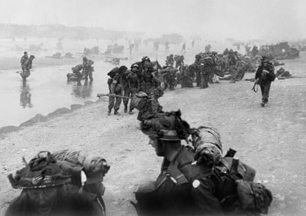 British troops take positions on Sword beach during D-day on 6 June 1944, when there was a small window of clear weather.Photograph: Imperial War Museum/AFP/Getty Images