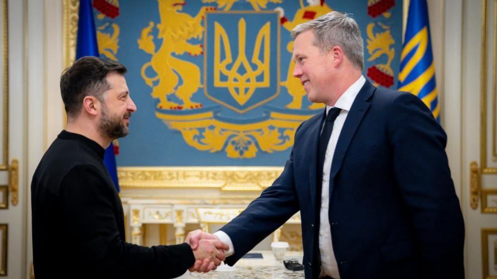 Image caption,Driscoll, seen here meeting Ukraine's Zelensky in November, resigned last week