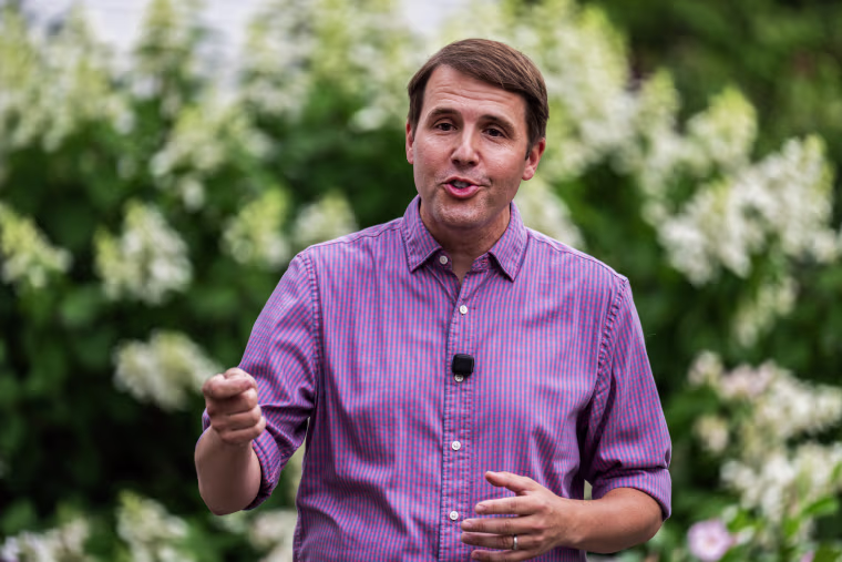 Rep. Chris Pappas, D-N.H., talks with voters in Warner last month.Tom Williams / CQ-Roll Call via Getty Images file