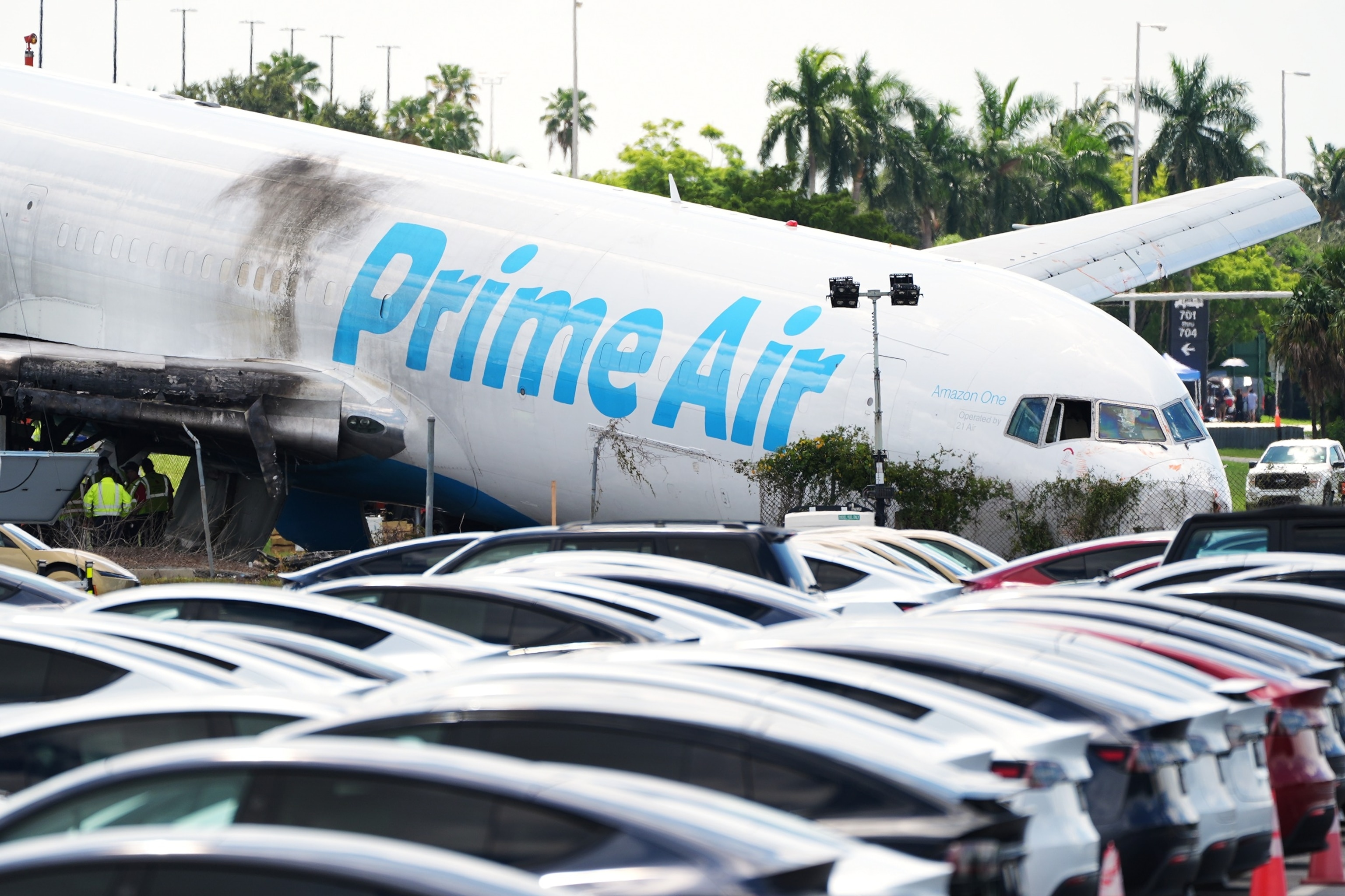 Workers inspect an Amazon cargo plane two days after it overshot a runway at Miami International Airport, Tuesday, Sept. 8, 2026, in Miami.Rebecca Blackwell/AP Photo